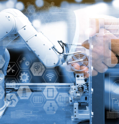 Industry 4.0 concept .Two Business people shaking hands with industry graphic sign and blue tone of automate wireless Robot arm in smart factory background. Double exposure ,blue tone